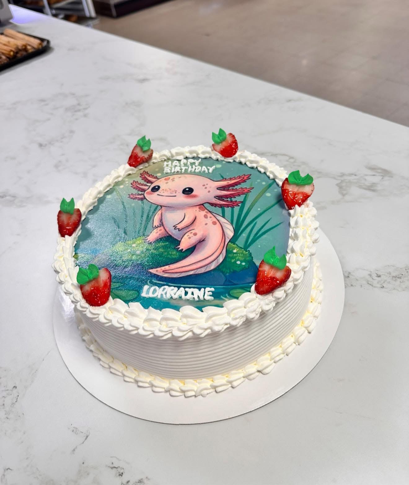 Custom birthday cake featuring a cute axolotl print for Lorraine