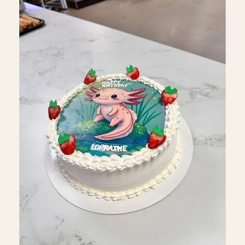 Custom birthday cake featuring a cute axolotl print for Lorraine