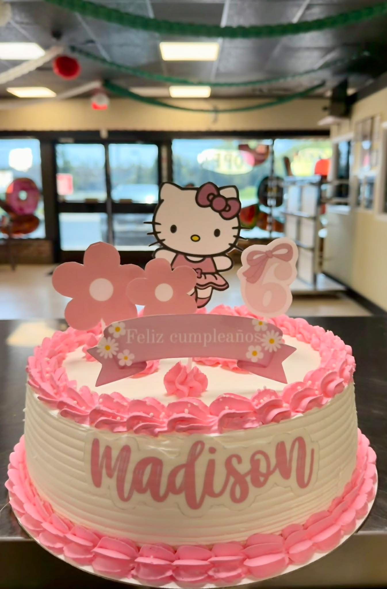 Pink custom Hello Kitty birthday cake for Madison