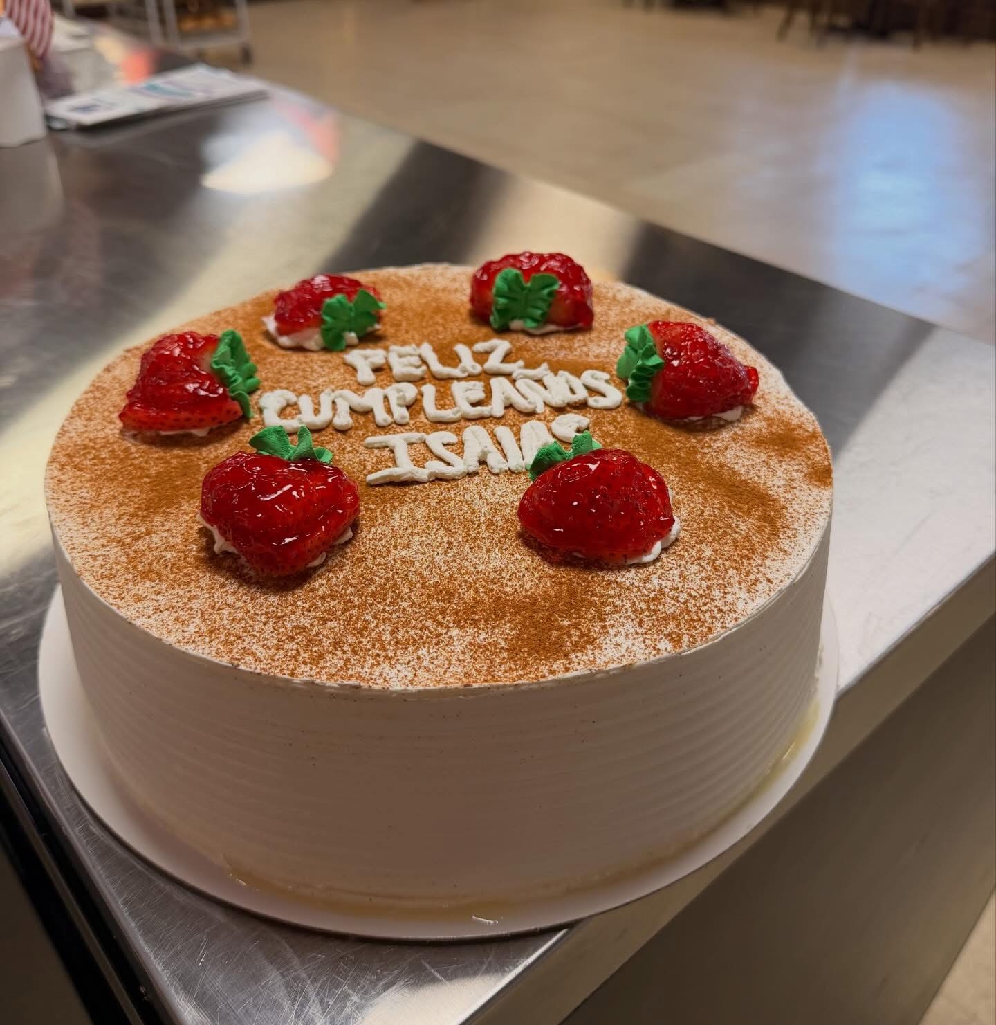 Strawberry Tres Leches birthday cake decorated with fresh berries for Isaias
