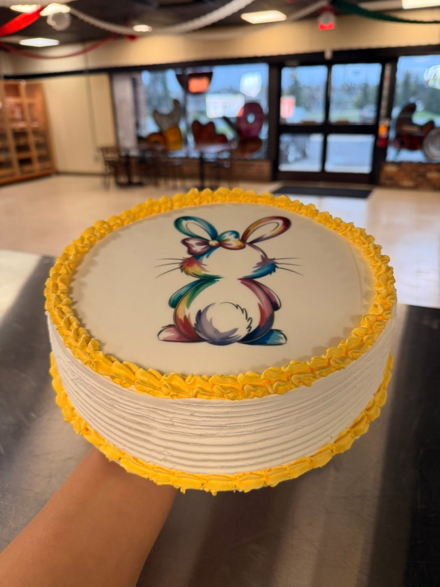 Beautiful custom painted Easter bunny round cake