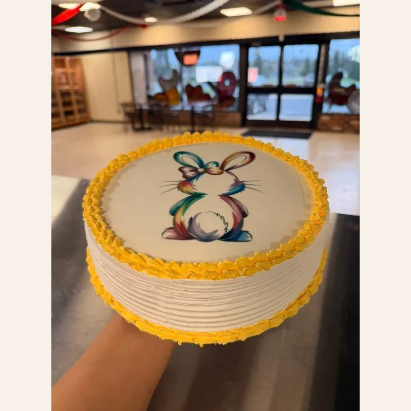 Beautiful custom painted Easter bunny round cake