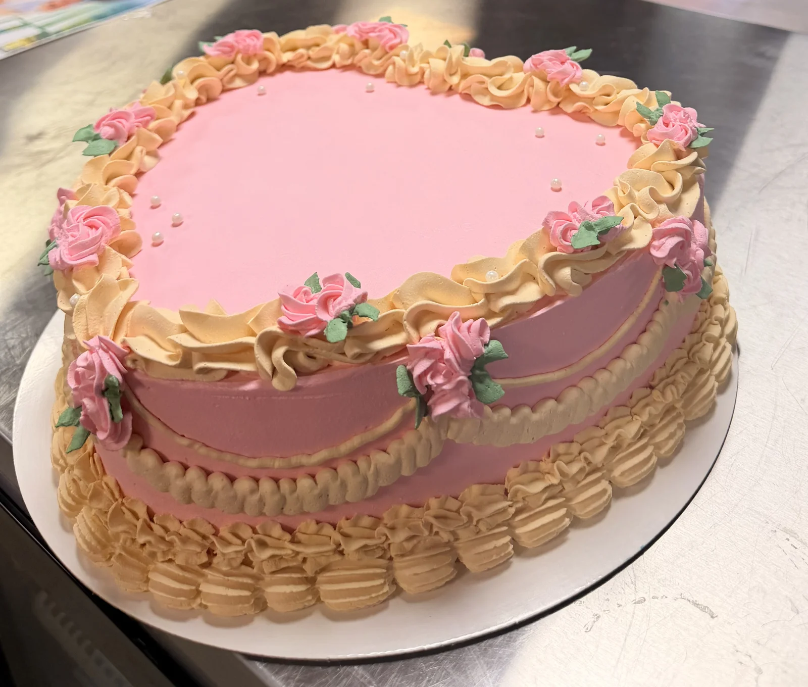 Heart shaped festive birthday cake