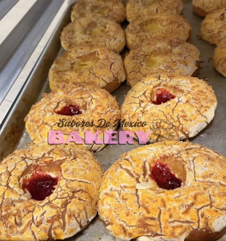 Besos sweet bread sandwiches with strawberry jam centers and sugar dust
