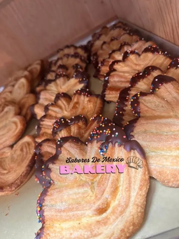 Orejas puff pastry ears drizzled with chocolate and sprinkles