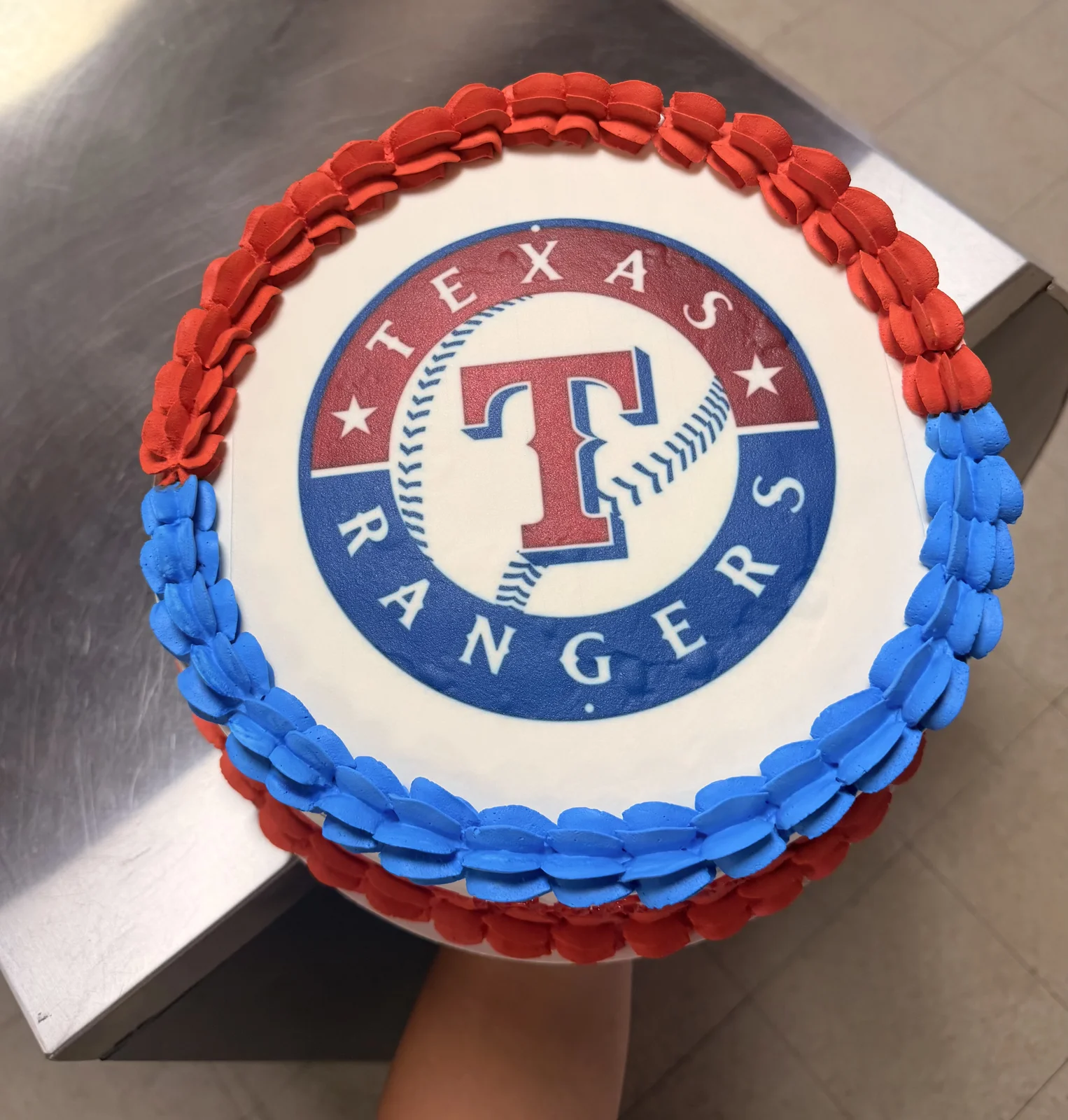 Custom Texas Rangers baseball birthday cake with red and blue frosting border